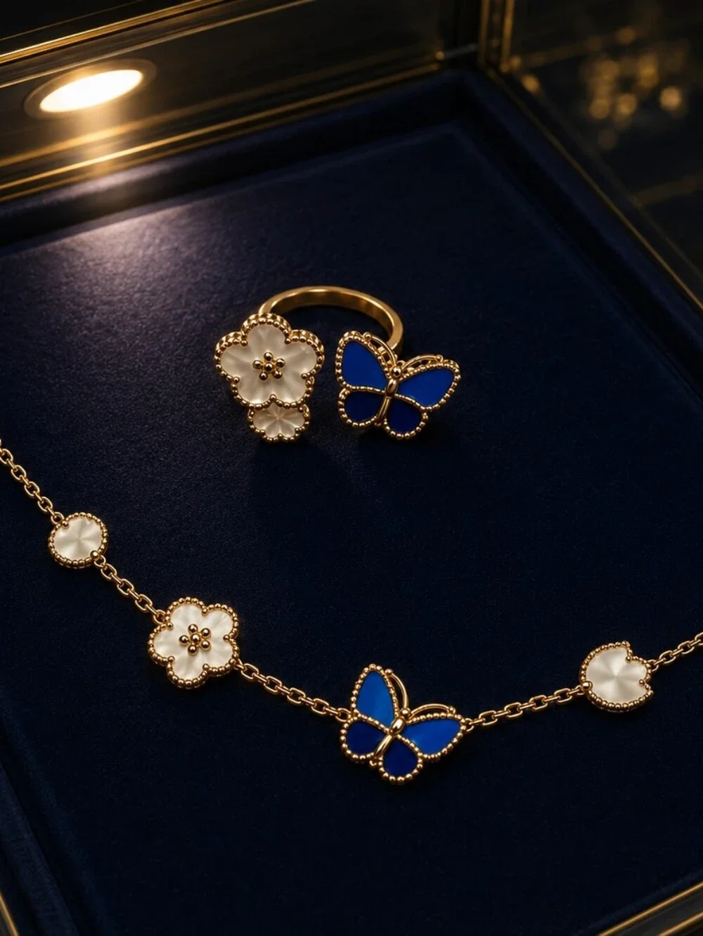 Gold Charm Bracelet with Blue Butterfly and Mother-of-Pearl Accents